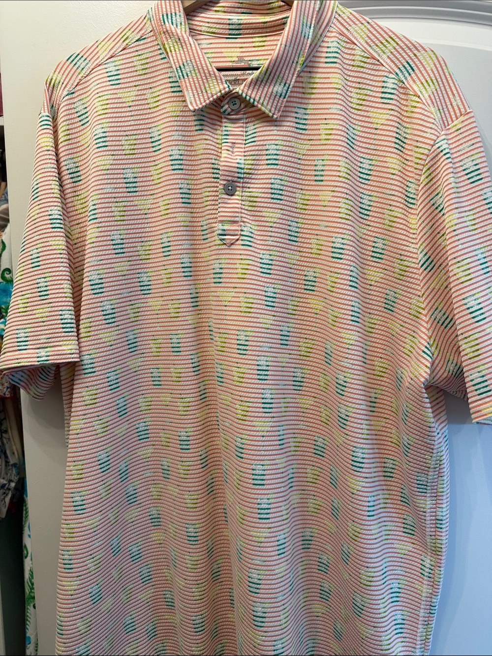 Tommy Bahama Pastel Pink Patterned Polo with Teal and Yellow Accents